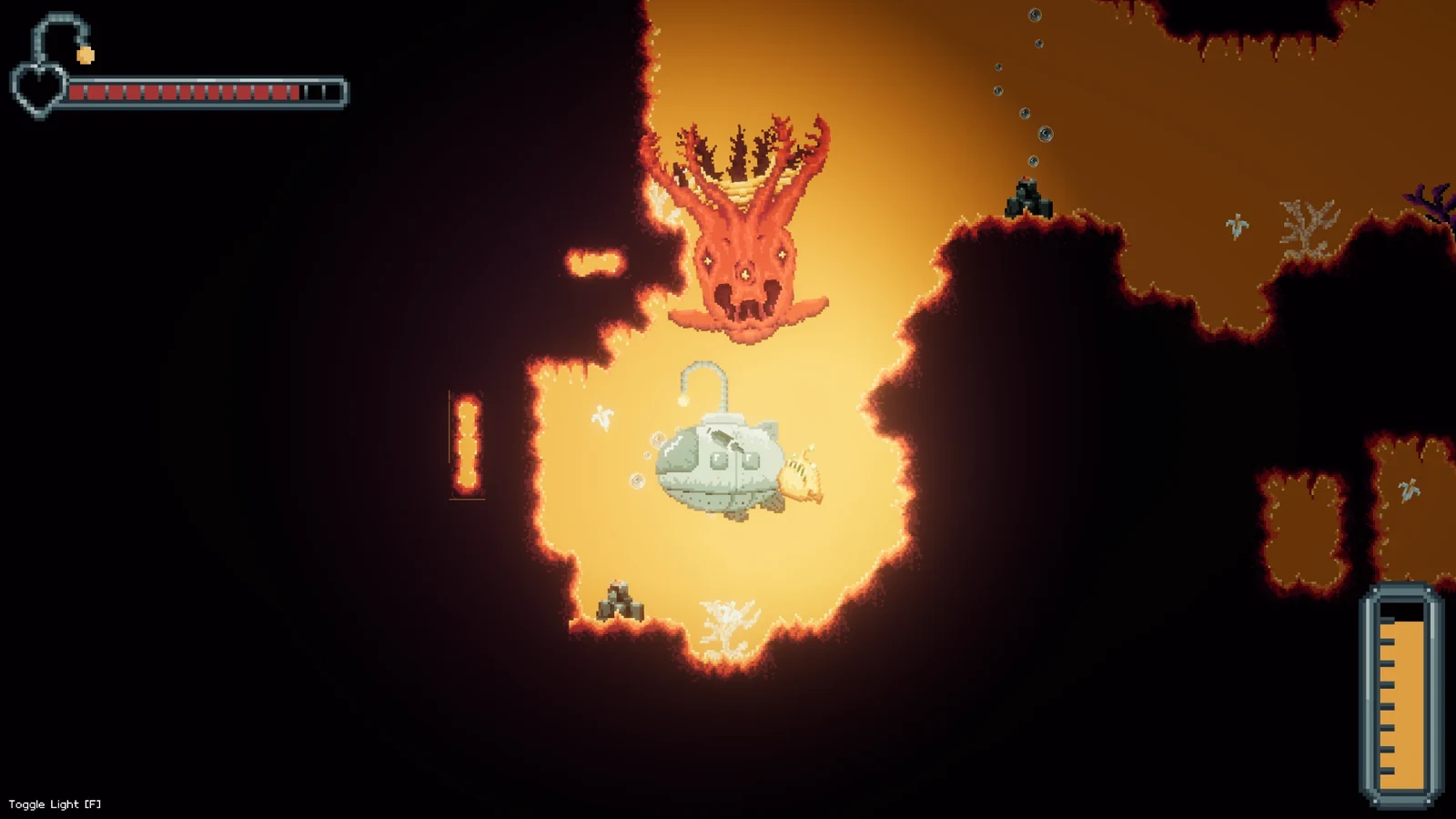 Mariana's Secret gameplay: the submarine faces a giant orange tentacled creature in a glowing amber cave